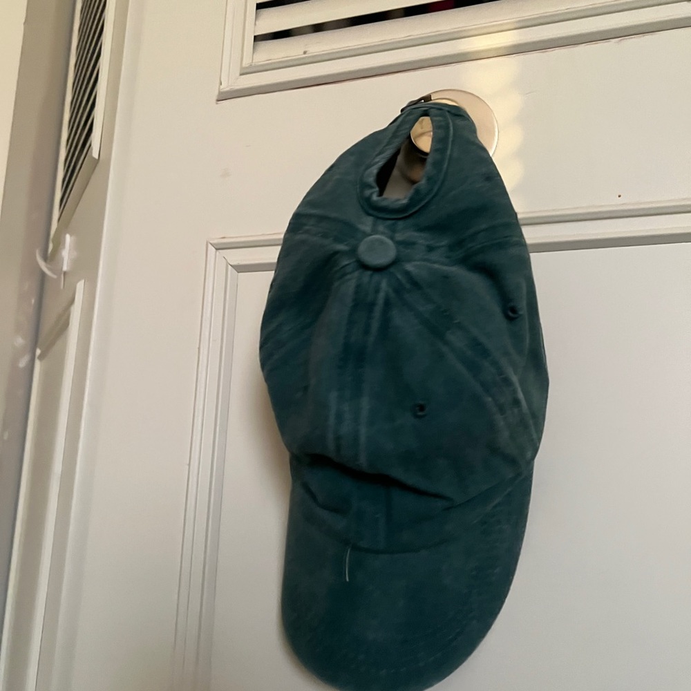 green baseball cap